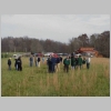 Crowd gathers in a field at CHMF for a demonstration of a tree planter.