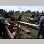 removing the finished board from the saw mill